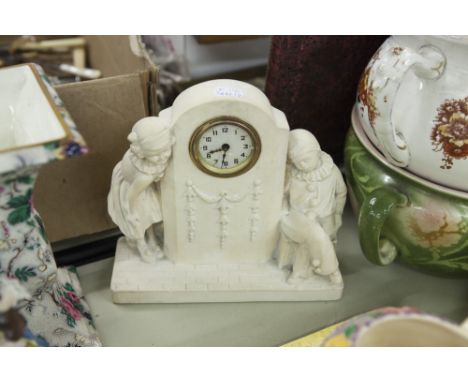1920'S WHITE ALABASTER FIGURAL MANTEL CLOCK, THE MILESTONE SHAPED CASE FLANKED BY A SLEEPING PIERROT BOY AND A YOUNG GIRL, ON