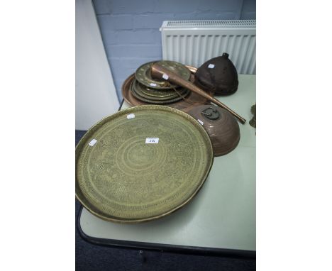 TWO INDIAN ENGRAVED BRASS CIRCULAR TRAYS; 10 VARIOUS EMBOSSED BRASS WALL PLAQUE AND TRAYS; COPPER HUNTING HORN, DOMED COPPER 