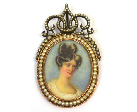 A mid 18th century French silver oval pendant centred with the portrait miniature of a young woman within a cultured pearl an
