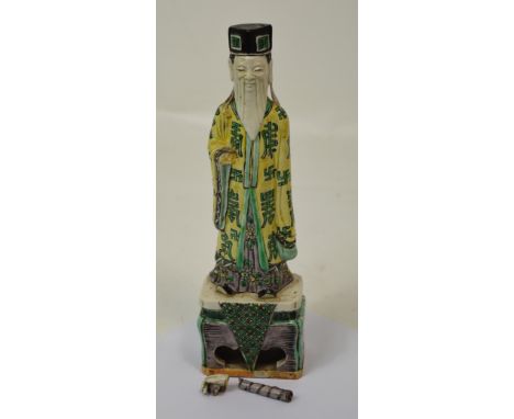A glazed Chinese ceramic figure of Fu, in need of restoration, height 27cm. CONDITION REPORT In need of professional restorat