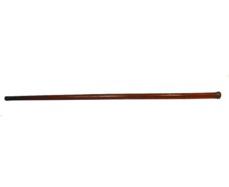 A Victorian gentleman's tipple stick, the cane with simulated grain effect enclosing integral clear glass phial and miniature