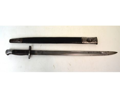 A WWI Second Welsh Fusiliers Sanderson Bayonet, with scabbard, engraved 1907, length 57cm.