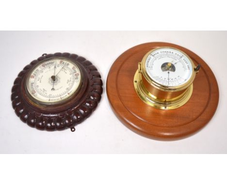 A brass ship's precision barometer mounted on circular wooden plaque and a smaller James Harris & Co of Middlesborough wall b