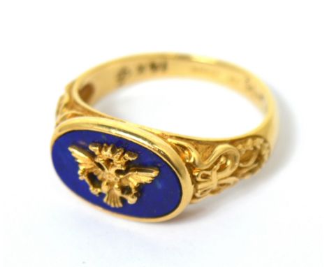 A 14ct gold and lapis lazuli 'Imperial Eagle' ring, by Franklin Mint Ltd, size U, with certificate of authenticity and accomp