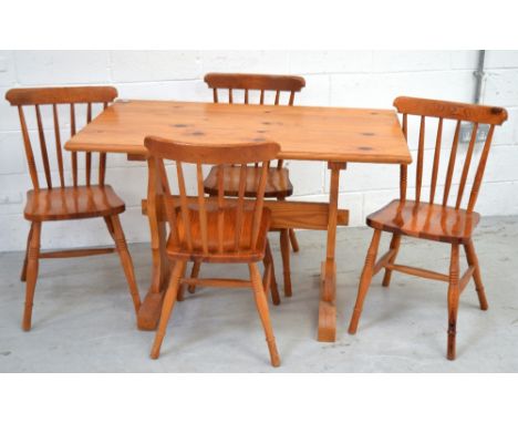 A pine refectory-style dining table, width 117cm and a set of four matching stick back chairs (5).