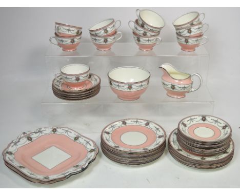 A pink ground Aynsley tea service comprising cups, saucers, sugar bowl and milk jug, tea plates and two cake plates. CONDITIO