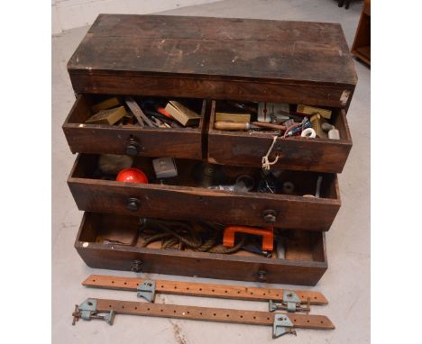 A Victorian mahogany two-over-two chest of drawers converted into a tool chest containing a large quantity of tools, width 10