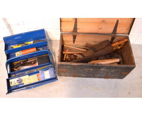 A wooden toolbox containing a quantity of tools to include a saw, hammer, etc and a later blue metal toolbox containing a fur