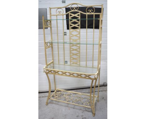 A metal display unit with three glass shelves and a lower ornate scrolling shelf, 160 x 94cm.