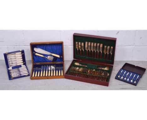 An oak cased canteen of silver plated cutlery and three further cased sets of flatware.