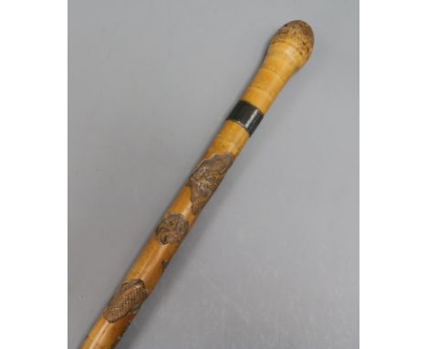 A Japanese carved bamboo walking stick