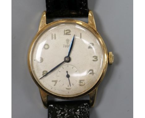 A gentleman's 9ct gold Tudor manual wing wrist watch, with subsidiary seconds, on later associated strap.