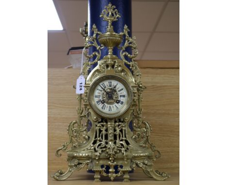 A French cast brass and enamel mantel clock Height 49cm