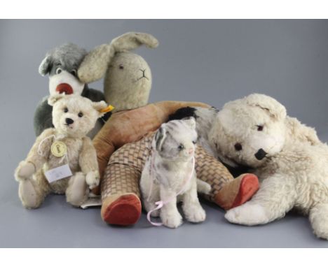 A classic Steiff cat, Disney Balou, two pyjama cases and large rabbit, tallest 21in.