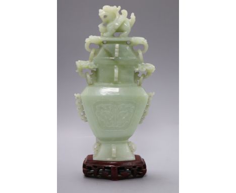 A Chinese bowenite jade vase, cover and stand in box