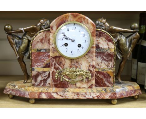 An Art Deco French rouge marble mantel clock