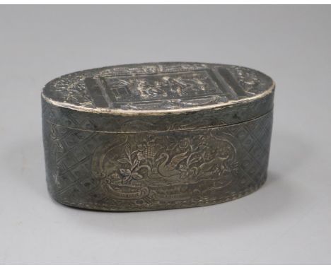 An 18th century French embossed oval white metal snuff box, decorate with trellis work and panels of figures, animals and flo