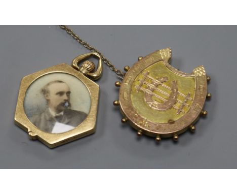 An early 20th century 15ct gold hexagonal portrait locket by M.B &amp; Co, with hinged border and a 9ct gold brooch.