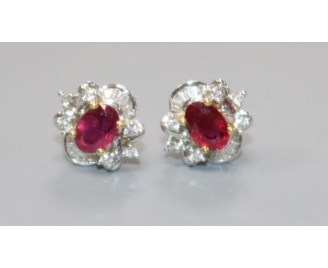 A modern pair of 18ct white gold, ruby and diamond cluster ear studs.