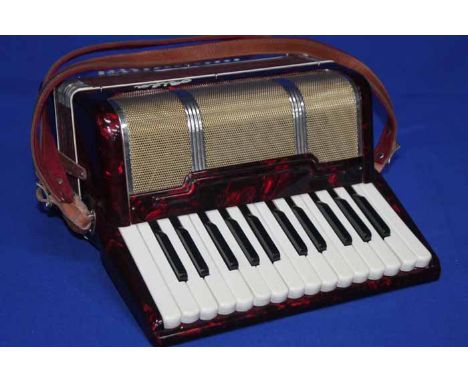 VINTAGE ALPHA ACCORDIAN
red lacquer body, in a black case, with leather shoulder strap, 42cm long