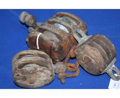 THREE VINTAGE ROPE PULLEYS
one a three line, one a two line, the other a two line with metal hook