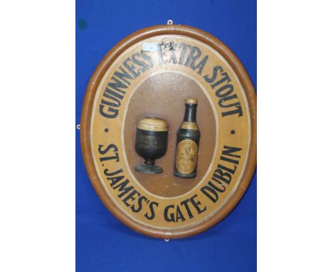 VINTAGE GUINNESS EXTRA STOUT WOODEN ADVERTISEMENT SIGN
of oval form, hand-painted, 61cm