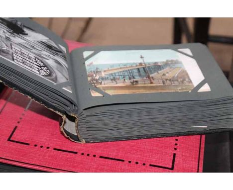 THREE VINTAGE POSTCARD ALBUMS
filled with 20th century postcards, some early 20th century, mainly souvenir cards of historic 