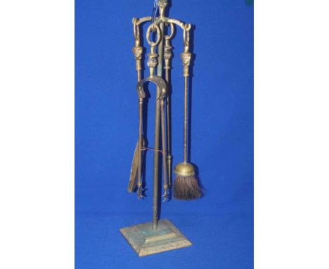 BRASS FIRE COMPANION
with four tools, on square base, 73cm high