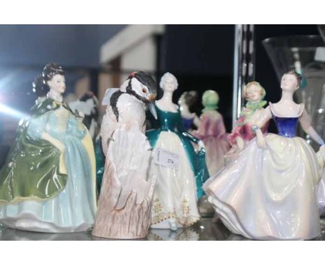 FOUR ROYAL DOULTON FIGURES
comprising Suzette HN2026, Lisa HN2394, Regal Lady HN2709, and Premiere HN2343, along with a Goebe