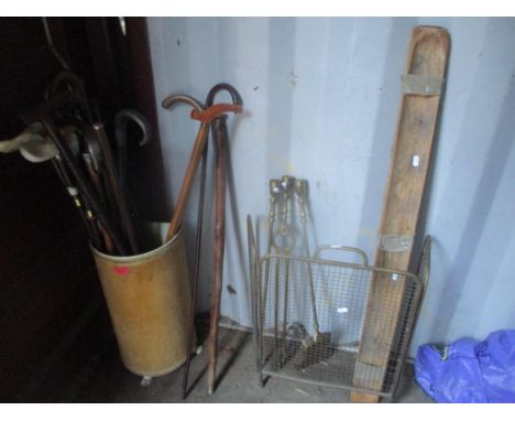 A mixed lot to include fireside implements, screen and mixed walking sticks in a stick standLocation: 