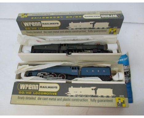 A Wrenn 00 gauge boxed locomotive and a LIMA one, one being a Coronation LMS green King George V (incorrect box) and a Sir Ni