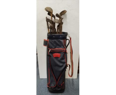 A set of twelve Hickory shafted golf clubs, caddy Location: