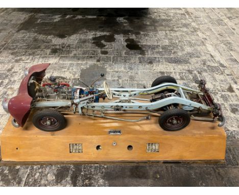 A German cut-away educational scale model of a commercial vehicle chassis, electrified for demonstration purposes, bearing la