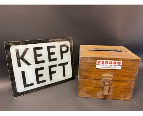 A Ferodo Brake Testing Meter empty box and a glass Keep Left illuminated bollard insert.