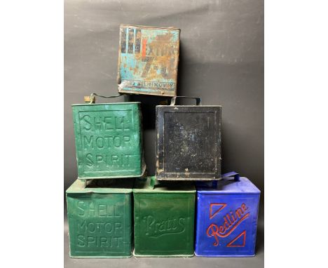 Five 2-gallon petrol cans including Redline plus an oil can.