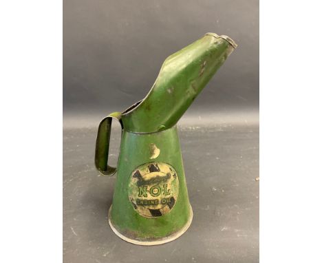 A Duckham's NOL Engine Oil quart measure.