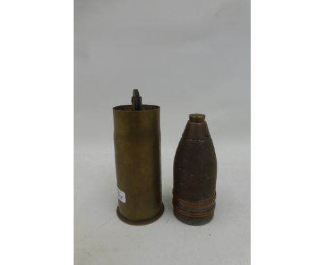A WW1 trench art table lighter made from an inert German shell dated 1916.
