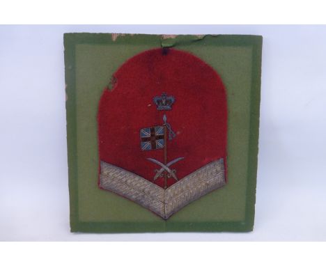 A framed and glazed Victorian British Army corporal stripes with bullion wire sleeve trade badge for swordsmanship (possibly 