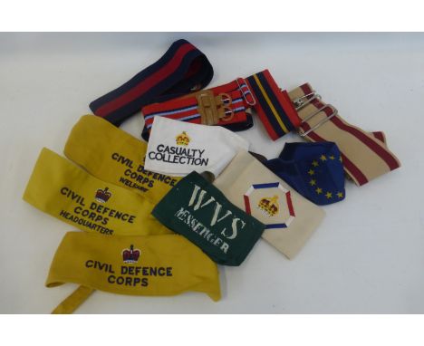 Five British Army stable belts and seven arm bands including Civil Defence Corps Headquarters & Welfare.