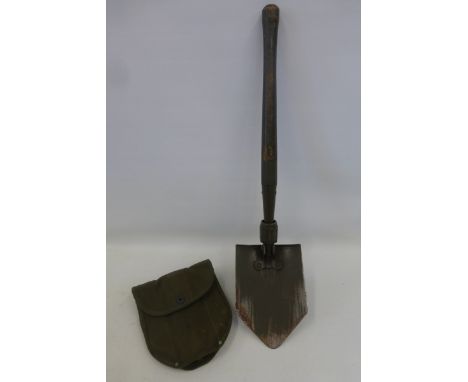 A 1945 dated U.S. Army entrenching tool made by Wood, in its case.