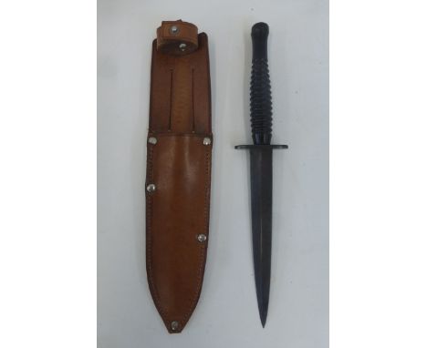 A hunting knife in leather sheaths.