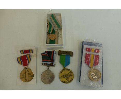 An assortment of U.S. Army and other medals.