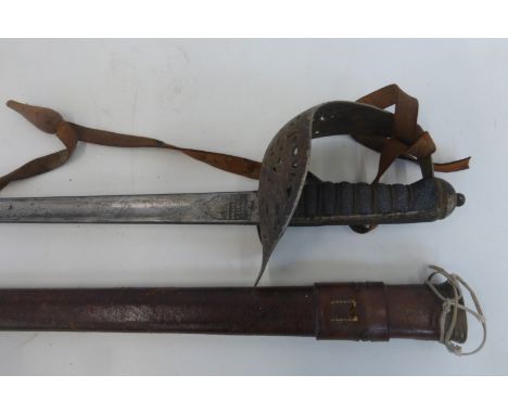 An Edward VII army officer's sword by Wilkinson in its leather scabbard with leather sword knot.