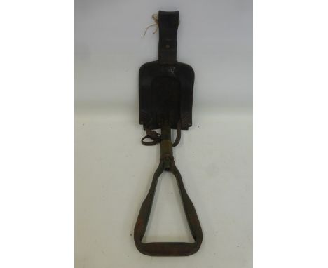 An Argentinean military entrenching tool with a black leather carry case.