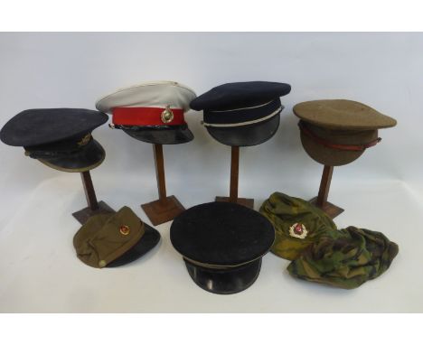 A box of eight military caps and hats including Royal Marines and Army Catering Corps.