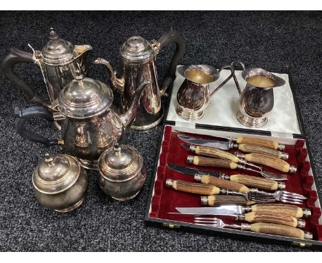 A Five Piece Silver Plated on Copper Tea Set, including coffee pot, teapot, lidded sugar bowls, with two cream jugs, stag han