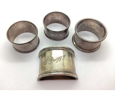 Four Hallmarked Silver Napkin Rings, including semi circle shaped with reeded decoration and personalised "Peggy", monogramme