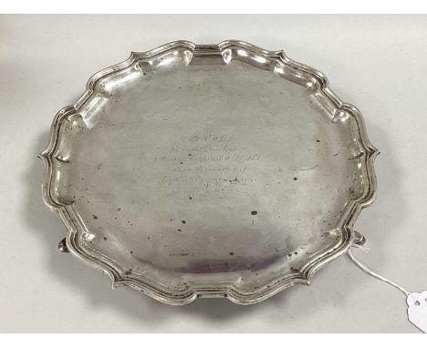 A Mappin &amp; Webb Hallmarked Silver Salver, M&amp;W, Sheffield 1930, of shaped circular form with flared rim, raised on thr