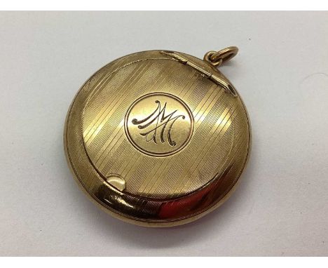 A Vintage 9ct Gold Powder Compact, of circular form with allover engine turned design and monogrammed "MM" to cartouche, hing
