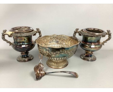 A Large Silver Plated on Copper Punch Bowl, scrolling foliage decoration in relief, gadrooned spreading base with twin lion m